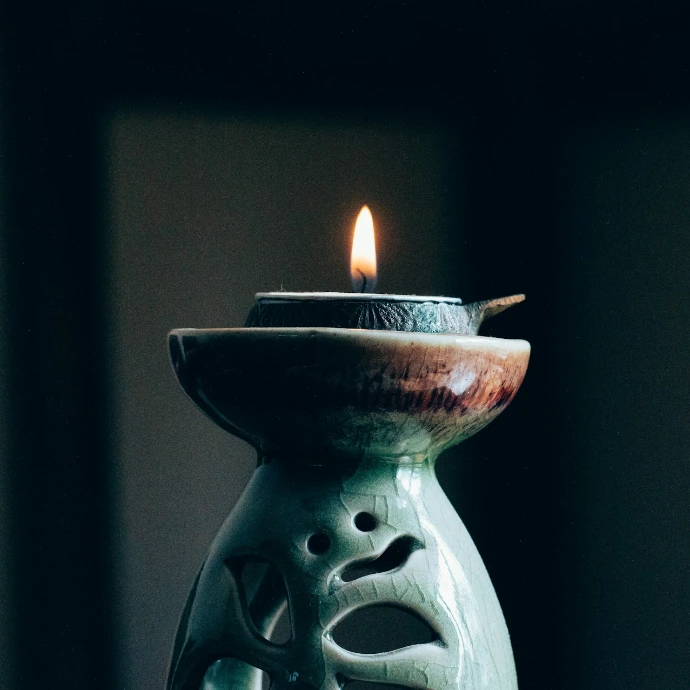 rule of thirds photography of lit candle